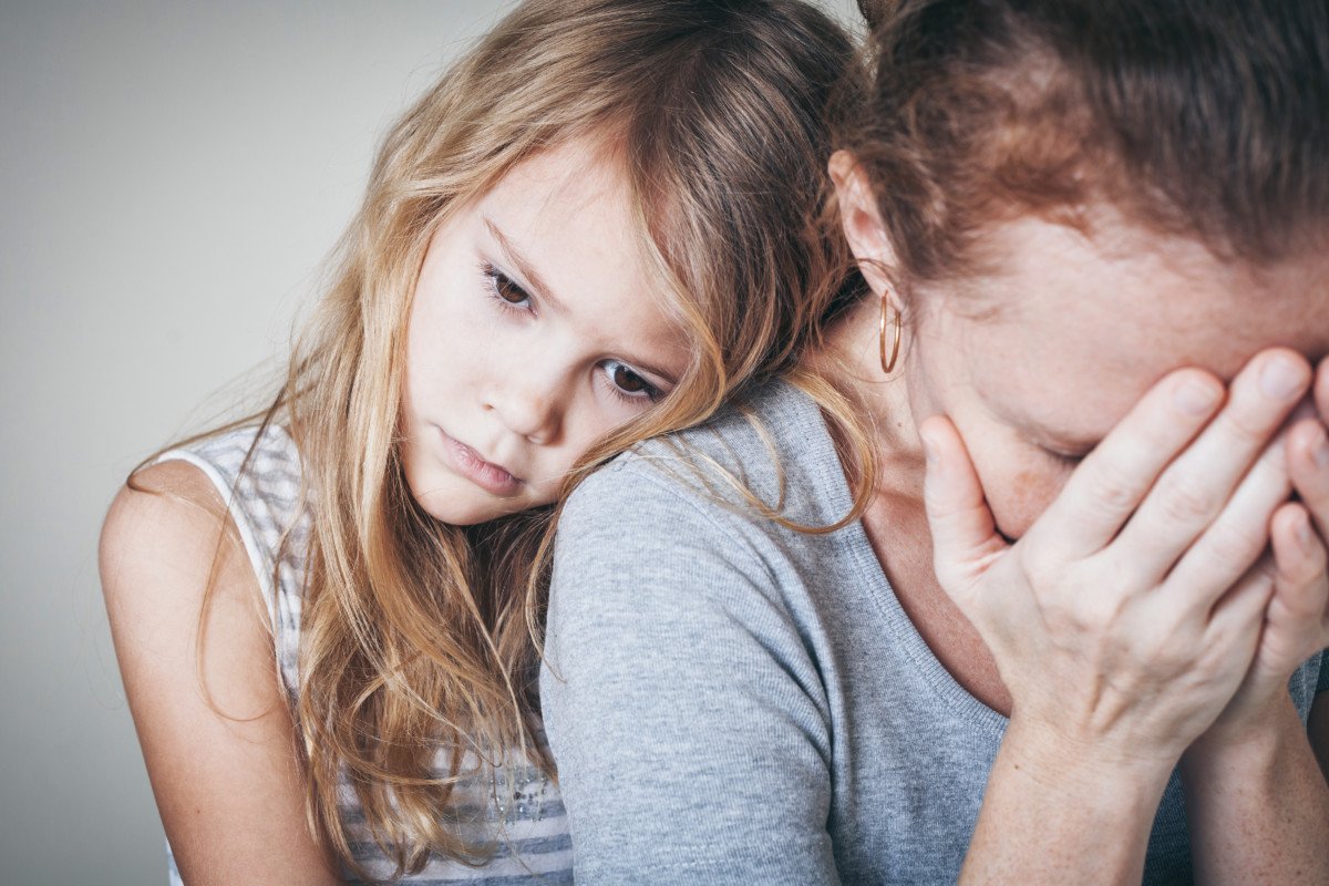 Sad Daughter Hugging His Mother sad daughter hugging his mother at home. Concept of couple family is in sorrow.